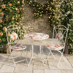 Conjunto de jardín compuesto por mesa redonda y dos sillas plegables de estructura metálica negra con asiento y tablero de mosaico decorativo, ideal para terraza o patio exterior.