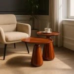 Set de mesa de centro de Artisa con diseño elegante, estructura de metal y acabado en piedra natural.