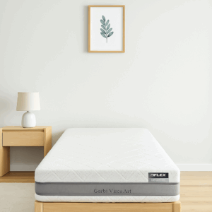 Colchón Flex Garbi Visco Art sobre cama de madera en habitación minimalista blanca