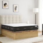 Colchón Flex Nube sobre canapé abatible de madera clara, cabecero beige capitoné y decoración minimalista en un dormitorio luminoso